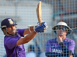 Sachin Tendulkar bats as coach Duncan Fletcher looks on during a practice session at Eden Garden in Kolkata on Monday ahead of the 3rd Test Match against England. PTI