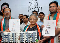 Delhi Chief Minister Sheila Dikshit (C) with Congress President for Gujarat Arjun Modhwadia and party MP Ashok Tanvar releasing the party manifesto for Assembly elections at a press conference in Ahmedabad on Tuesday. PTI Photo