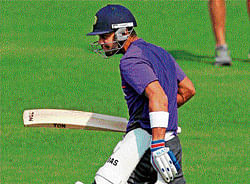 dont mess with me! Virat Kohli in a playful mood as he walks out for a nets session in Kolkata on Tuesday. Pti
