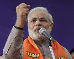 Gujarat Chief Minister and Bharatiya Janata Party (BJP) leader Narendra Modi speaks at a function to mark former Deputy Chief Minister and Congress party leader Narhari Amin joining the BJP, in Ahmadabad, India, Thursday, Dec. 6, 2012. The first phase of polling for the Gujarat state Asembly elections are scheduled for Dec. 13. AP