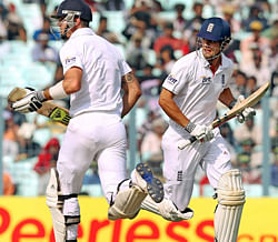 England's Alastair Cook and Kevin Pietersen take a run during Day 3 of the 3rd Cricket Test Match against India at Eden Garden in Kolkata on Friday. PTI Photo