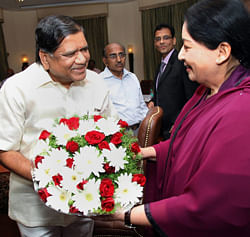 Tamil Nadu Chief Minister J Jayalalithaa is greeted with a bouquet by her Karnataka counterpart Jagadish Shettar prior to their meeting on the Cauvery water sharing issue in Bengaluru on Thursday. PTI Photo