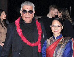International fashion icon Roberto Cavalli poses with hotel staff upon his welcome in New Delhi on Thursday. PTI Phot
