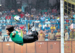 Scorpion save! Former Colombian goalkeeper Rene Higuita makes his trademark save during an exhibition match in Kolkata on Saturday. PTI