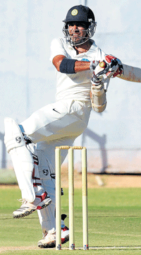 back in form: Robin Uthappa hits one to the boundary during his unbeaten 77 on Sunday. dh photo/ srikanta sharma r