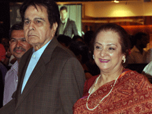Bollywood actor Dilip Kumar (L) and his wife Saira Banu arrive to attend the premier of Hindi film Talaash directed by Reema Kagti in Mumbai late November 29, 2012. Bollywood superstar Aamir Khan is back on the Indian big screen on November 30, in his first commercial film release for three years, taking up the role of a mustachioed police inspector in a Mumbai crime thriller. AFP photo