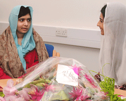 Asifa Bhutto (R), the daughter of Pakistan's President Asif Ali Zardari, meeting with Pakistani schoolgirl who was shot by the Taliban Malala Yousafzai (L) at the Queen Elizabeth Hospital in Birmingham, central England on December 8, 2012. Zardari on December 8 visited a Pakistani schoolgirl who is recovering in a British hospital after she was shot by the Taliban for campaigning for girls' education. Zardari also met with 15-year-old Malala Yousafzai's family during a private meeting at the specialist Queen Elizabeth Hospital in Birmingham, central England, where Malala was flown from Pakistan in October following the brutal attack on her school bus. AFP photo