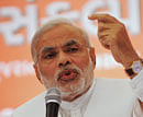 Communal plank missing, Modi fights poll on development agenda