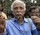 CPI (M) MLA Shahjahan Chowdhury shows his broken glasses after clash with MLAs of Trinamool Congress in the West Bengal Assembly following a protest, in Kolkata on Tuesday. PTI Photo