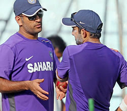 Skipper MS Dhoni talks to Gautam Gambhir at a practice session at Eden Garden in Kolkata on Monday ahead of the 3rd Test Match against England. PTI Photo