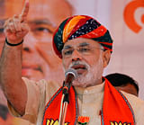 Gujarat chief minister Narendra Modi speaks during an election campaign rally for the upcoming Gujarat state assembly elections in Kheda, near Ahmadabad, India, Wednesday, Dec. 12, 2012. The first phase of polling for the elections is scheduled to be held on Dec. 13. AP Photo
