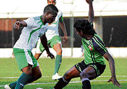 SKILFUL: HASCs Emmanuel (left) tries to move past SUFCs Amit Raj Banshi in a  Super Division match. DH PHOTO
