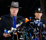 Connecticut State Police spokesman Lt. J. Paul Vance (L) and Lt. George Sinko of the Newtown Police Department brief the media on the elementary school shooting during a press conference at Treadwell Memorial Park on December 14, 2012 in Newtown, Connecticut. According to reports, 27 are dead, including 20 children, after a gunman identified as Adam Lanza in news reports, opened fire in at the Sandy Hook Elementary School in Newtown, Connecticut. Lanza also reportedly died at the scene. AFP photo