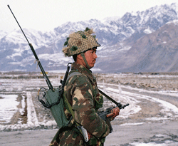 In this handout file photograph released by the Minister of Defence and taken 25 December 2001, an Indian soldier stands guard on the Siachen Glacier close to the line of control between India and Pakistan. Six Indian soldiers are dead and another missing December 16, 2012 following an avalance in the Siachen Glacier area, a local report said citing Indian Army sources. AFP PHOTO