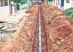 Underground drain under construction since several months at Chamarajanagar. DH PHOTO