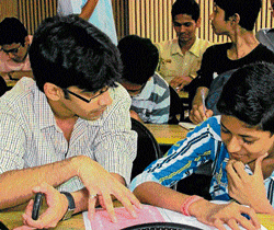 By their side: IITians help engineering and medical aspirants from economically weaker sections.