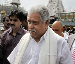 Industrialist Vijay Mallya coming out after offering prayers at Lord Venkateswara temple at Tirumala in Tirupati on Tuesday. PTI Photo