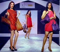 : Models showcase leather products during a fashion show in Kolkata on Saturday night. PTI Photo