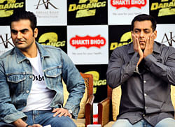 Arbaaz Khan,  and Salman Khan listen to a question during a promotional event of their upcoming Hindi film Dabangg 2in New Delhi on Tuesday. AP
