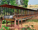 waste' plant: (Top) A conveyor belt with trolleys at the defunct waste-to-energy plant started at Mandur six years ago in a dilapidated state.