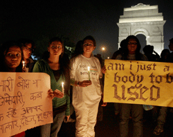 Volunteers of Better India participating in a candle light protest at India Gate in New Delhi on Tuesday condemning the gang rape of a 23-year-old student on a city bus. PTI Photo
