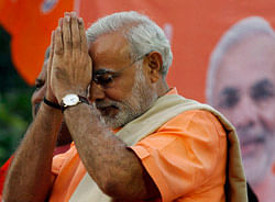 Gujarat state chief minister Narendra Modi greets supporters during the celebrations of Gujarat assembly elections in Ahmadabad, India, Thursday, Dec. 20, 2012. Hindu nationalists won a resounding victory Thursday in state elections in western India, buttressing the political strength of Modi, the Hindu ideologue and polarizing figure whose supporters believe could become prime minister in 2014. (AP Photo