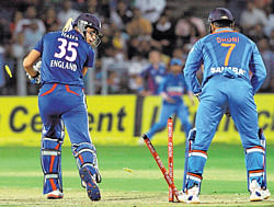 Englands Alex Hales (left) has his stumps uprooted by Indias Yuvraj Singh (not seen) on Thursday. PTI