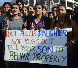 Indian students holds placards as they shout-slogans against a recent rape that took place in New Delhi during a protest in Amritsar on December 20, 2012. Despite an outpouring of anger at a student's gang-rape, observers say misogyny remains widespread in India where sex assaults are often dismissed as 'teasing' and victims find themselves blamed for attacks. The December 16 assault on a bus in New Delhi, which left a 23-year-old victim fighting for her life, has triggered nationwide revulsion and protests. AFP PHOTO