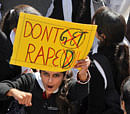 A college student shouts slogans as she holds a placard during a protest in Jammu December 20, 2012. Thousands of protesters took to the streets in various parts of the country to demand urgent action against the men who took turns to rape a 23-year-old woman on a moving bus on December 16, local media reports said. REUTERS