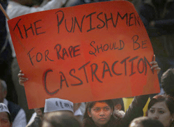 An young Indian girl holds a placard as she participates in a protest against the inefficiency of government in punishing rapists as the conviction rate in the entire country remains extremely low, in New Delhi, India, Friday, Dec. 21, 2012. The hours-long gang-rape and near-fatal beating of a 23-year-old student on a bus in New Delhi recently has triggered outrage and anger across the country as Indians demanded action from authorities who have long ignored persistent violence and harassment against women. AP