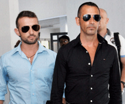 Italian marines Massimiliano Latorre (R) and Salvatore Girone come out of the office of the police commissioner in Kochi on Thursday. The marines are accused of shooting two Indian fishermen. PTI