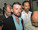 Italian marine Salvatore Girone, arrives at Kochi International airport for transport to Italy, in Kochi, India, Friday, Dec. 21, 2012. The passports of the Italian marines, Massimiliano Lattore and Salvatore Girone were released by the Kollam District and Sessions Court on Friday, after an Indian court ruled Thursday that the two Italian marines detained for the deaths of two fishermen can go home for Christmas. Latorre and Girone were aboard a cargo ship in February 2012 when they opened fire on a fishing boat they mistook for a pirate craft and killed two Indian fishermen, according to local news reports. (AP Photo)