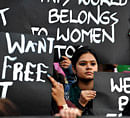 Indian activists belonging to various rights organisations hold placards while they stage a demonstration in Bangalore on December 21, 2012, condemning the recent gang rape in New Delhi. India's government, facing swelling protests over the gang-rape of a female student on a bus, has vowed to press for life sentences for her six attackers and promised stricter policing. AFP PHOTO
