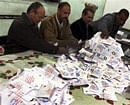 1 of 30. Officials count ballots after polls closed in Bani Sweif, about 115 km (71 miles) south of Cairo December 22, 2012. Early indications showed Egyptians approved an Islamist-drafted constitution after Saturday's final round of voting in a referendum despite opposition criticism of the measure as divisive.  Credit: Reuters/Stringer
