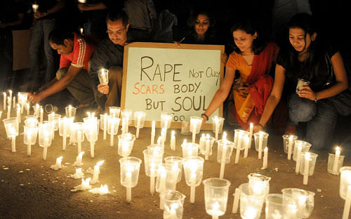 Protesters light candles to pray for the Delhi gang rape victim in Mysore on Sunday.  DH Photo