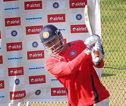 : India's M S Dhoni plays a shot during a practice session on the eve of the 1st T20 match against Pakistan at Chinnaswamy stadium in Bengaluru. PTI Photo