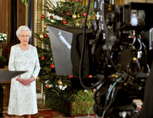 Queen Elizabeth II records her Christmas message to the Commonwealth which is to be broadcast in 3D for the first time, in the White Drawing Room at Buckingham Palace in London on December 23, 2012. AFP PHOTO