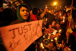 People protesting against the brutal gang-rape of a woman on a moving bus last week in New Delhi, hold candles during a protest in Allahabad, India, Tuesday, Dec. 25, 2012. Authorities shut down roads in the heart of India's capital for the second consecutive day on Tuesday to put an end to a week of demonstrations against the gang-rape.