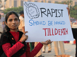 People take part in a silent march against Delhi gang rape case in Mumbai on Thursday. PTI