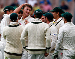 Australia's Jackson Bird (L) celebrates with team mates after dismissing Sri Lanka's Thilan Samaraweera LBW for one run during the third day of the second cricket test at the Melbourne Cricket Ground December 28, 2012. REUTERS