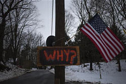 A sign is posted on an electricity pole outside a house near Sandy Hook Elementary School, nearly two weeks after a gunman shot dead 20 students and six adults, in Newtown, Connecticut December 27, 2012. REUTERS