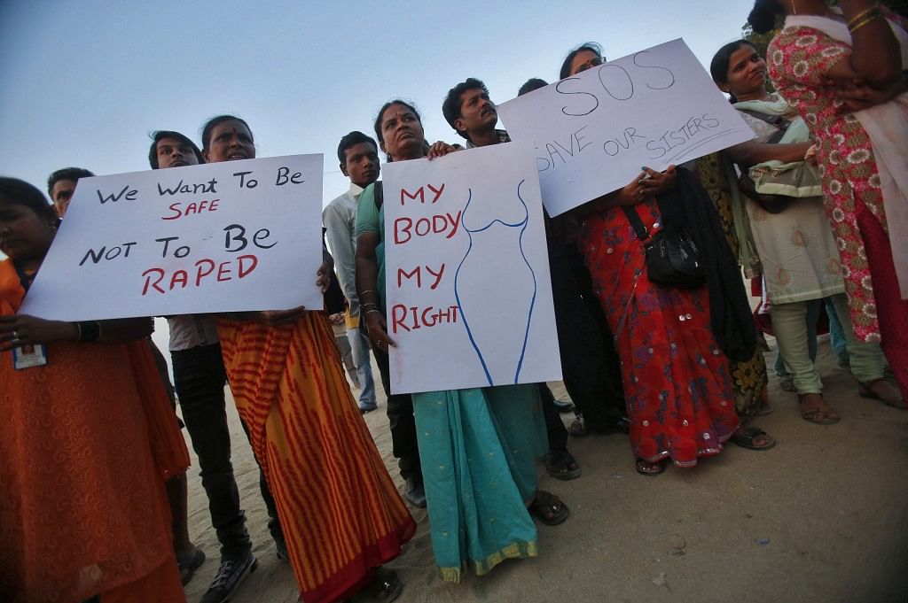 Demonstrators hold placards as they take part in a protest rally in solidarity with a rape victim from New Delhi in Mumbai December 27, 2012. Reuters