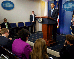 U.S. President Barack Obama stands at the lectern to make a statement to reporters after meeting with congressional leaders at the White House in Washington December 28, 2012. Obama held out hope for a last-minute agreement to avoid the fiscal cliff of tax increases and spending cuts after a meeting with congressional leaders, scolding Congress for leaving the problem unresolved until the eleventh hour. REUTERS