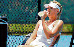 All set: Sharapova cools off during a training session. AFP