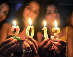 Young girls welcoming the New Year 2013 in Bhopal on Monday evening. PTI