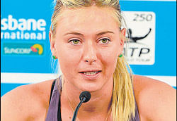 Disappointed: Sharapova announces her withdrawal at a press conference on Tuesday . AFP