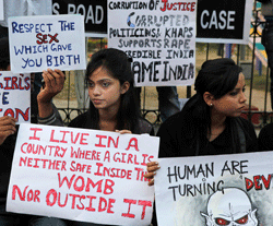 Indian students participate in a protest against a leader of the ruling Congress party on accusations he raped a woman in a village in the early hours of the morning, in Gauhati, India, Thursday, Jan. 3, 2013. Footage on Indian television showed the extraordinary scene of local women surrounding Bikram Singh Brahma, ripping off his shirt and repeatedly slapping him across the face. A Dec. 16 gang rape on a woman, who later died of her injuries, has caused outrage across India, sparking protests and demands for tough new rape laws, better police protection for women and a sustained campaign to change society's views about women. (AP Photo