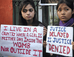 Young girls display placards during a demonstration demanding justice for the rape victims, in Guwahati on Thursday. PTI