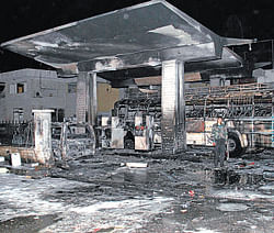 The bombed petrol station in Damascus Alawites on Thursday. AFP