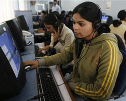 Employees at a call centre provide service support to customers in Siliguri February 2, 2008.  Credit: Reuters